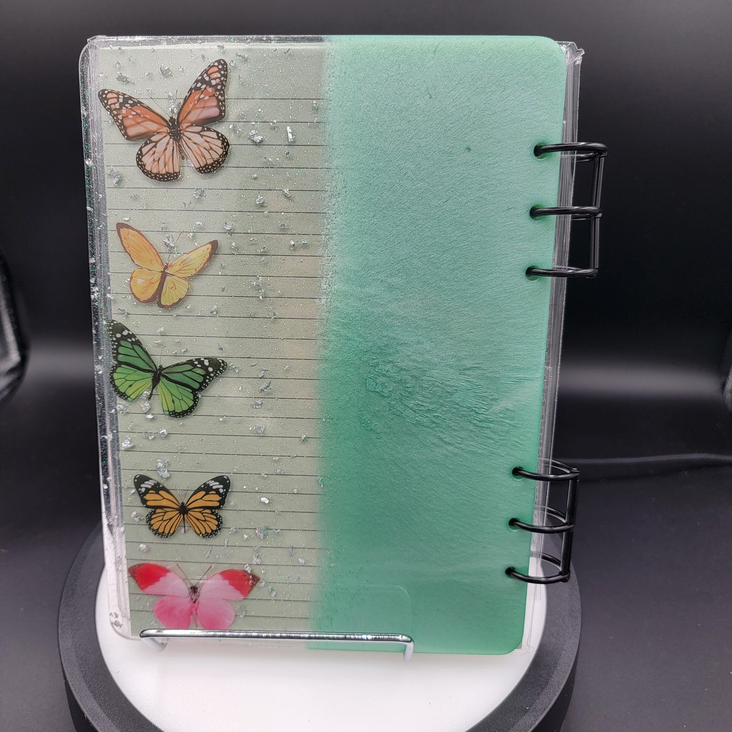 Notebook with butterfly designs on a clear plastic cover