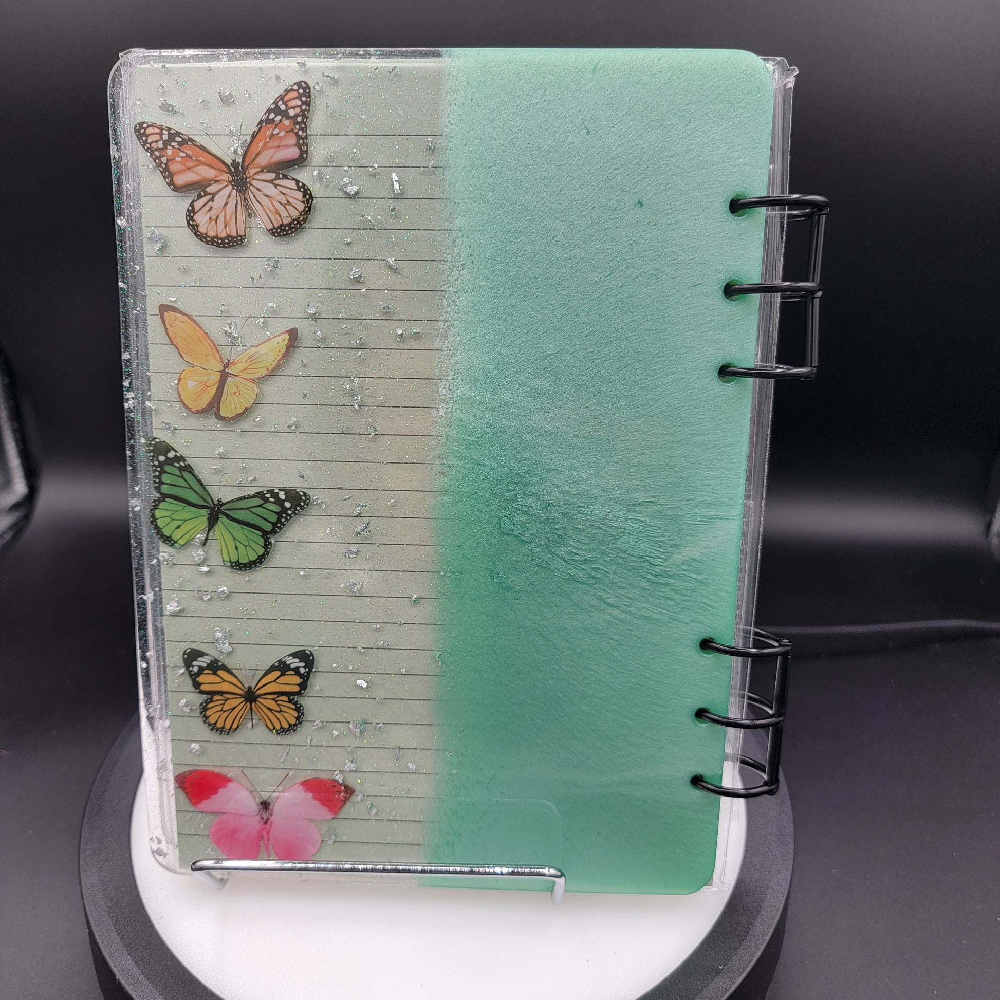 Notebook with butterfly designs on a clear plastic cover