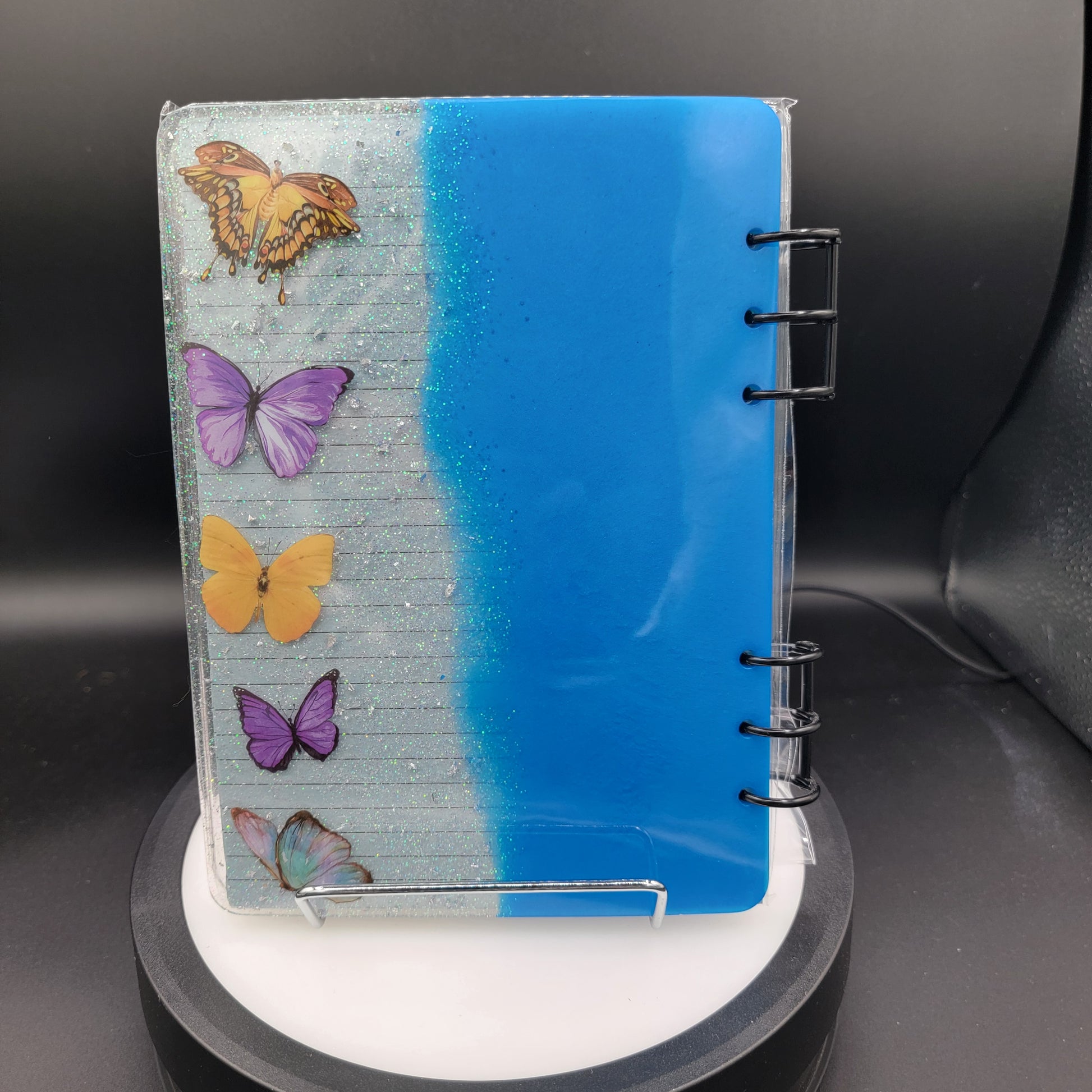 Small notebook with butterfly designs on a black background