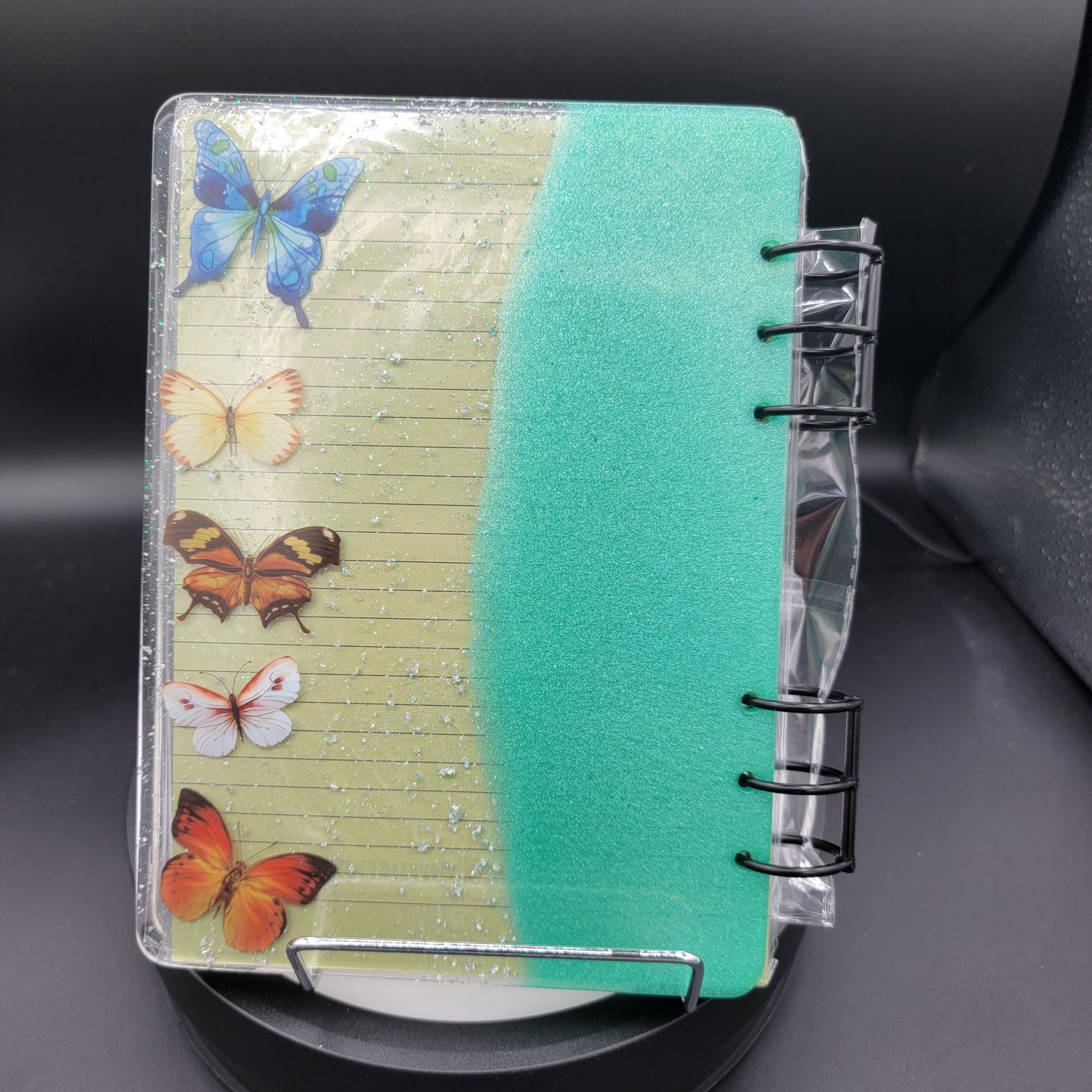 Notebook with butterfly design on a car seat
