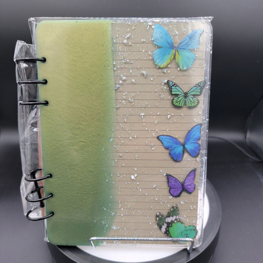Notebook with butterfly designs on a clear cover